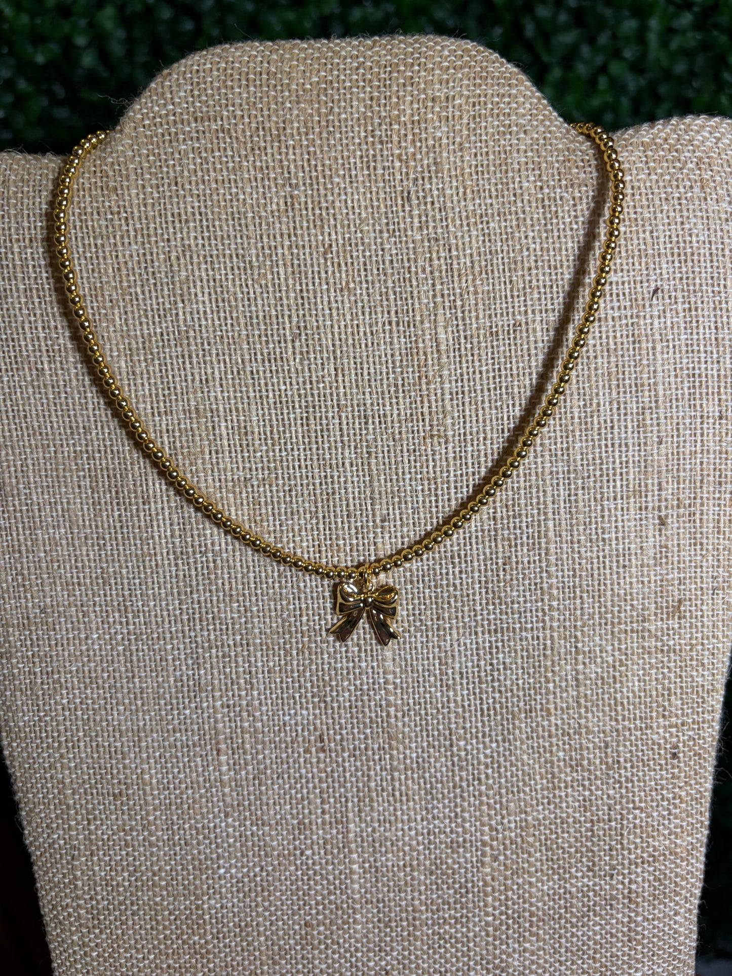 Gold Beaded Necklace with Gold Bow