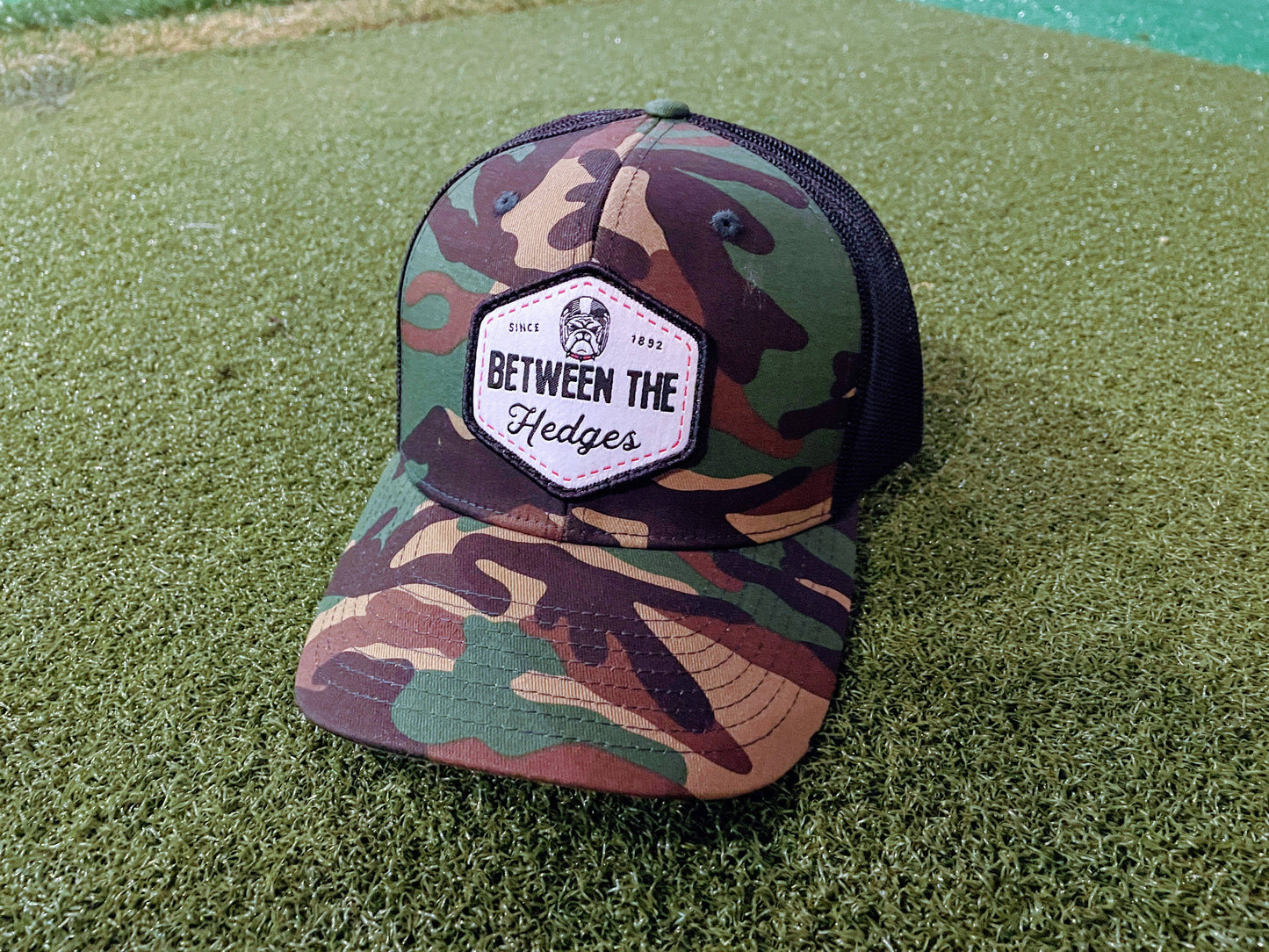 Camo & Black "Between The Hedges" Trucker Hat