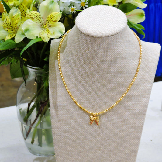 Gold Beaded Necklace with Gold Bow