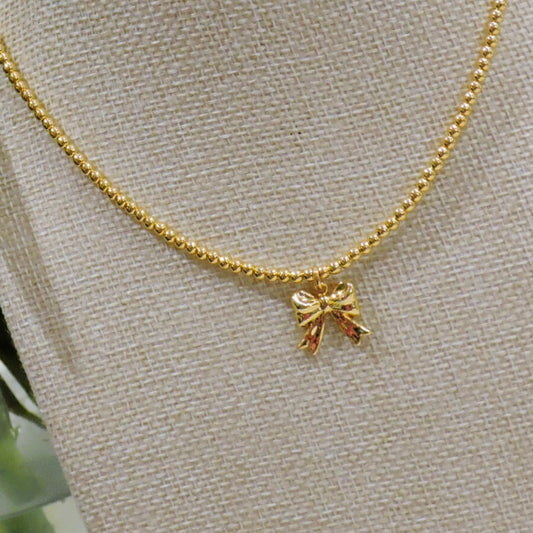 Gold Beaded Necklace with Gold Bow