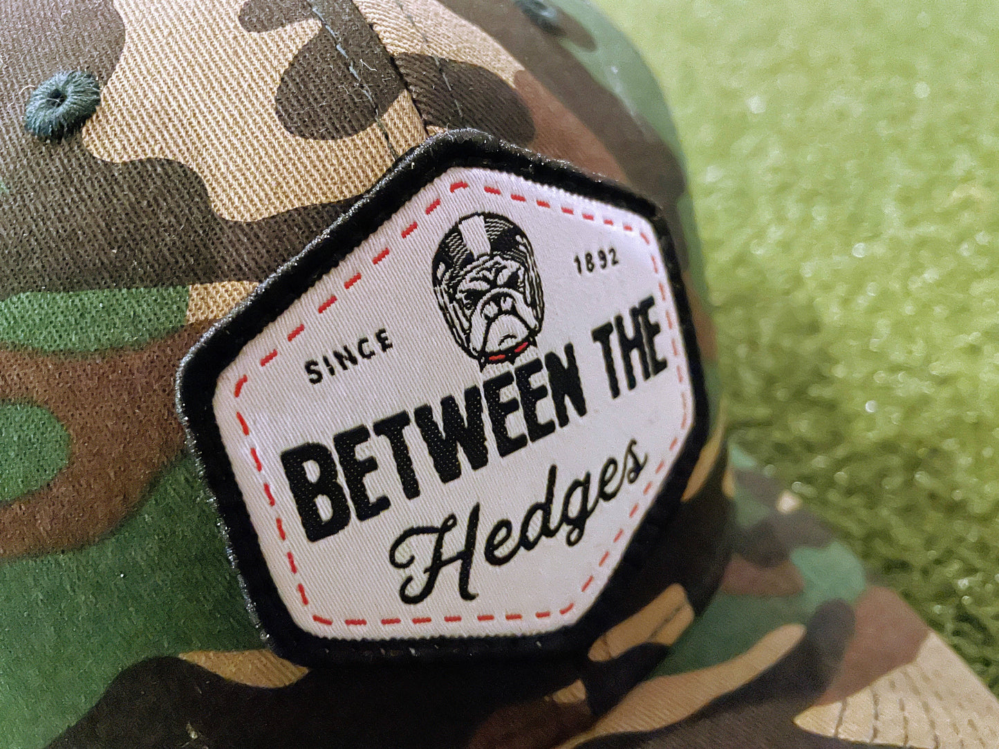 Camo & Black "Between The Hedges" Trucker Hat